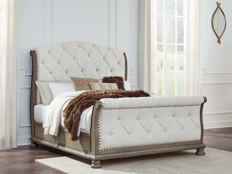 Ardenfield Queen Upholstered Sleigh Bed with Mirrored Dresser and Nightstand
